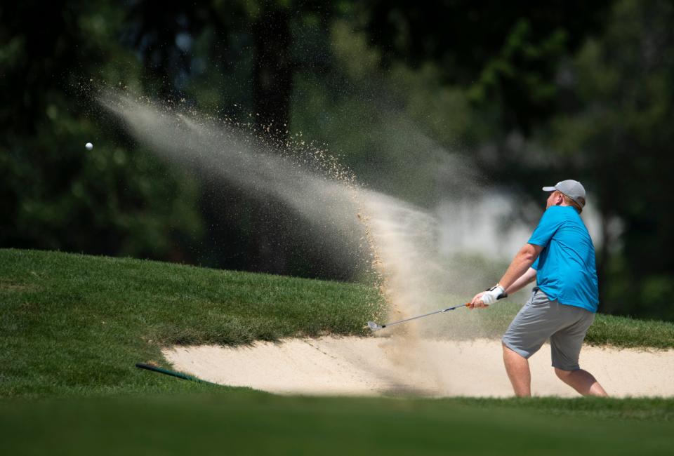 David Mills shoots from the bunker for the 16th green during the fourth and final round of the Evansville Men's City Golf Tournament at Evansville Country Club Sunday afternoon, July 24, 2022. David Mills came out on top by eight strokes (-17) and lead wire-to-wire in the tournament.