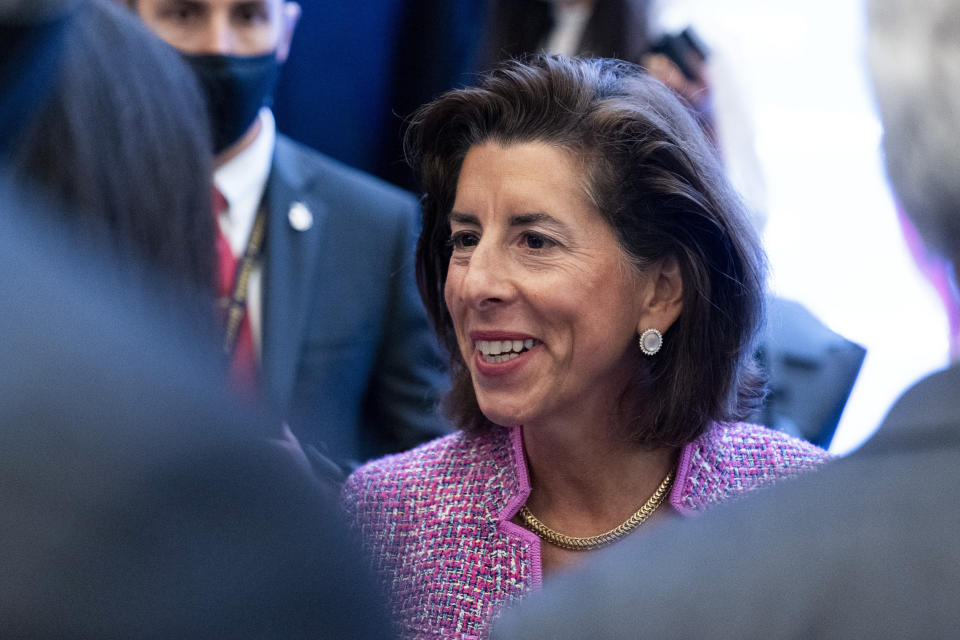 In this Tuesday, Sept. 28, 2021, photo Commerce Secretary Gina Raimondo greets people after speaking at The Economic Club of Washington. As President Joe Biden's de facto tech minister, Raimondo is tasked with ensuring the United States will be the world leader in computer chips. The lowly computer chip has become the essential ingredient for autos, medical devices, computers, phones, toys, thermostats, washing machines, weapons, LED bulbs, and even some watches. But there is a global shortage, creating a drag on growth and fueling inflation on the cusp of the 2022 elections. (AP Photo/Alex Brandon)