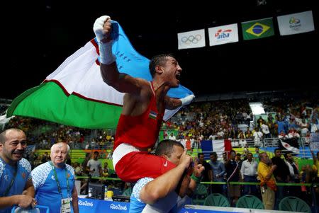 2016 Rio Olympics - Boxing - Final - Men's Light Welter (64kg) Final Bout 272 - Riocentro - Pavilion 6 - Rio de Janeiro, Brazil - 21/08/2016. Fazliddin Gaibnazarov (UZB) of Uzbekistan celebrates after winning his bout. REUTERS/Peter Cziborra