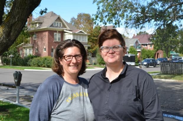 Christy Tashjian, left, and her wife Jenni Huntly moved from Texas to Thunder Bay when Huntly received a job in the northwestern Ontario city. Tashjian, a nurse practitioner in the U.S., thought it would be easy to become registered in Ontario. But more than 20 months later, she's still waiting to work. (Logan Turner / CBC - image credit)