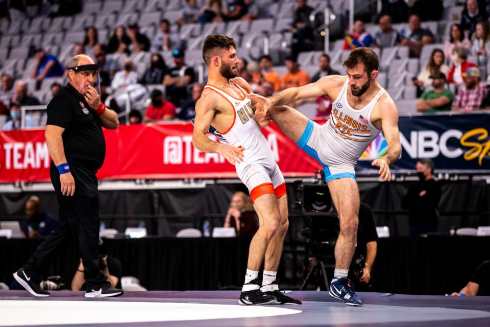 Thomas Gilman, left, wrestles Zane Richards at 57 kg during the first session of the USA Wrestling Olympic Team Trials, Friday, April 2, 2021, at Dickies Arena in Fort Worth, Texas.