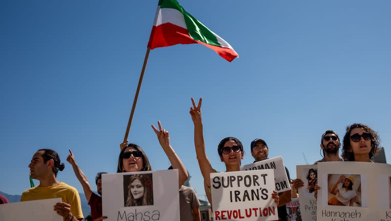 Sama and Sima, who asked that their last names be withheld, show peace signs during a protest against the Iranian regime at the Capitol in Salt Lake City on Saturday, Sept. 16, 2023. The protest was held on the one-year anniversary of the death of Mahsa Amini, who was arrested by Iran’s morality police for allegedly violating the country’s strict dress code for women.