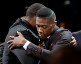 <p>Kris Dunn hugs a supporter after being selected fifth overall by the Minnesota Timberwolves during the NBA basketball draft, Thursday, June 23, 2016, in New York. (AP Photo/Frank Franklin II) </p>