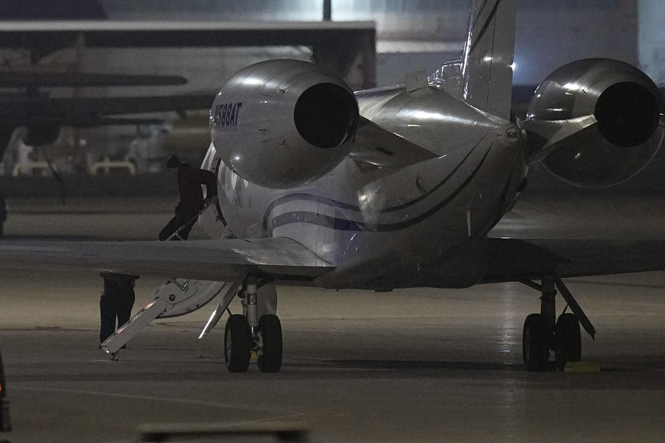 WNBA star Brittney Griner deplanes at Kelly Field in San Antonio, Texas, following her release in a prisoner swap with Russia, Friday, Dec. 9, 2022. (AP Photo/Eric Gay)