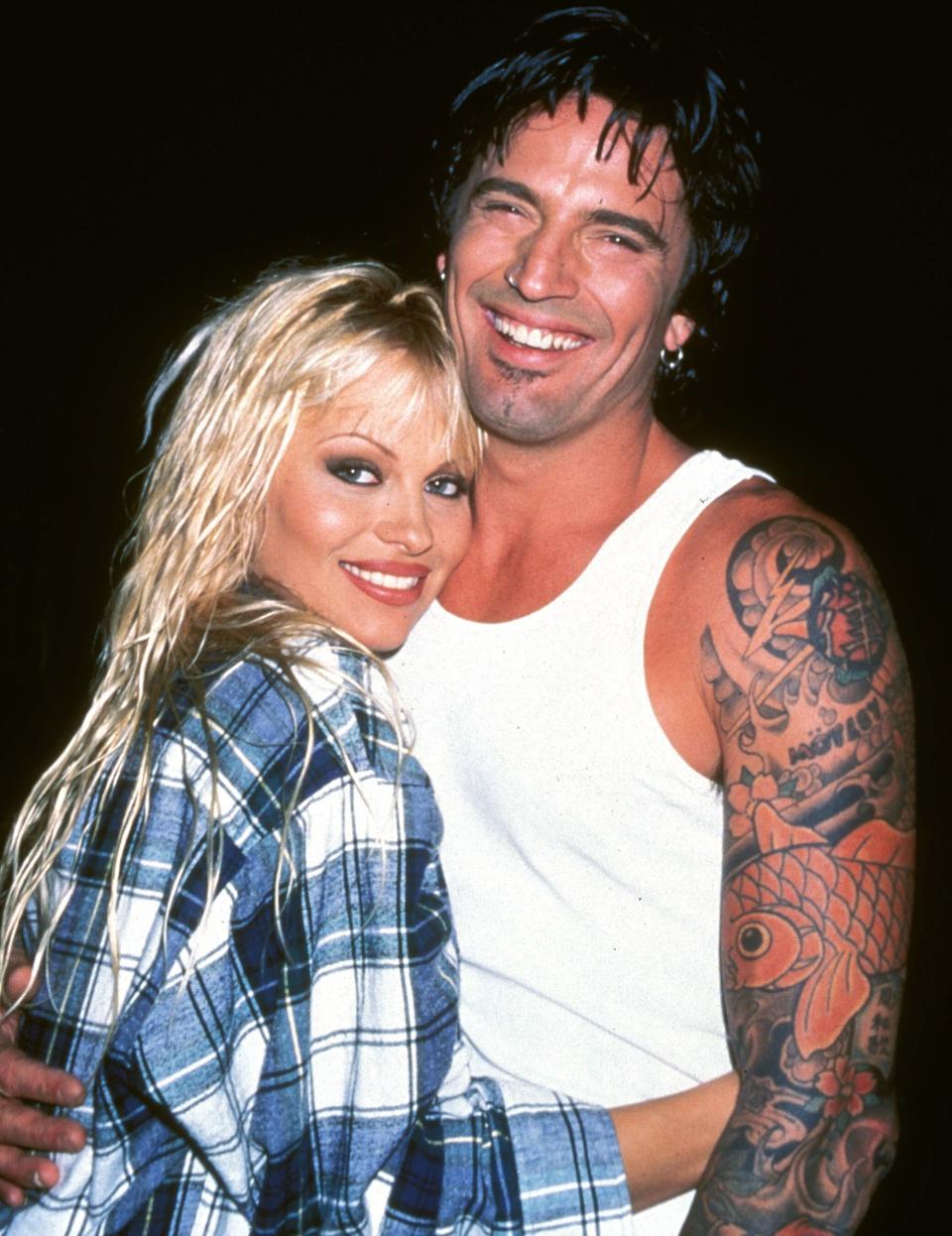 After knowing each other for just 96 hours, <em>Home Improvement</em> and <em>Baywatch</em> star Anderson and Mötley Crüe rocker Lee <a href="http://people.com/archive/bliss-on-the-beach-vol-43-no-9/" rel="nofollow noopener" target="_blank" data-ylk="slk:eloped on the beach;elm:context_link;itc:0;sec:content-canvas" class="link ">eloped on the beach</a> in Mexico in 1995 (her parents had never even heard of him). He'd previously been married to Heather Locklear; she'd been linked to <em>Baywatch </em>costar David Charvet, TV<em> Superman </em>Dean Cain, MTV veejay Eric Nies, Australian-born surfer Kelly Slater and Sylvester Stallone.