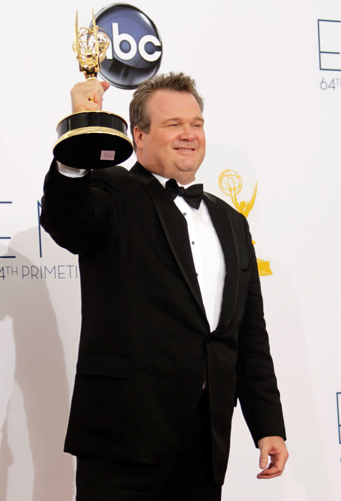 Eric Stonestreet, winner Outstanding Supporting Actor In A Comedy Series for "Modern Family," poses in the press room at the 64th Primetime Emmy Awards at the Nokia Theatre in Los Angeles on September 23, 2012.