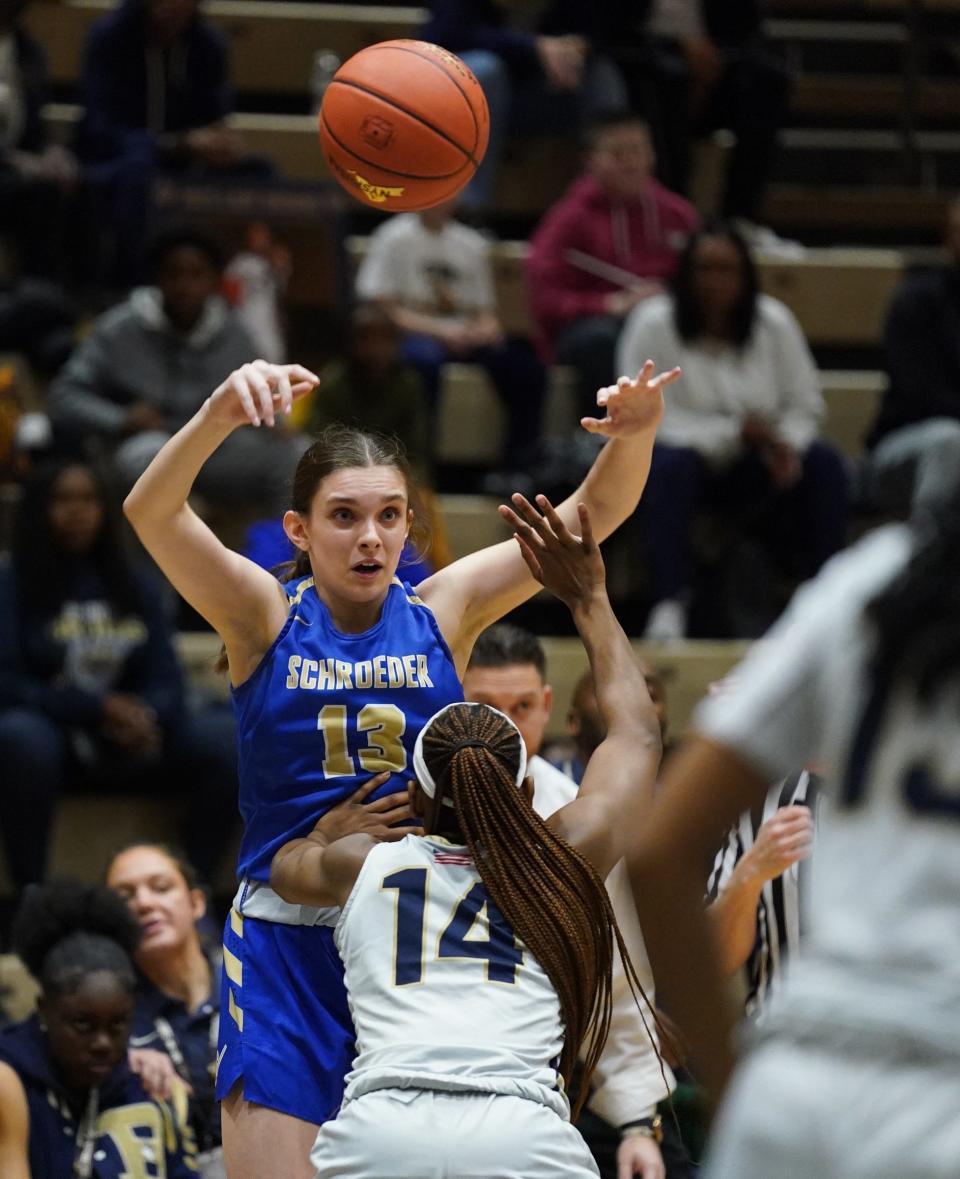 Webster-Schroeder's Ava Gallup (13) fires a pass toward the paint in the girls Class AA state semifinal game against Baldwin at Hudson Valley Community College in Troy, on Friday, March 17, 2023.