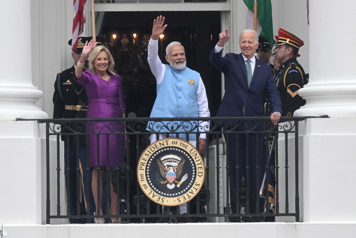 June 22, 2023: US First Lady Jill Biden, India's Prime Minister Narendra Modi, and President Joe Biden wave from the Truman Balcony during a welcoming ceremony for Modi at the White House in Washington, DC.