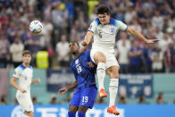 England's Harry Maguire, right, vies for the ball with Haji Wright of the United States during the World Cup group B soccer match between England and The United States, at the Al Bayt Stadium in Al Khor , Qatar, Friday, Nov. 25, 2022. (AP Photo/Luca Bruno)