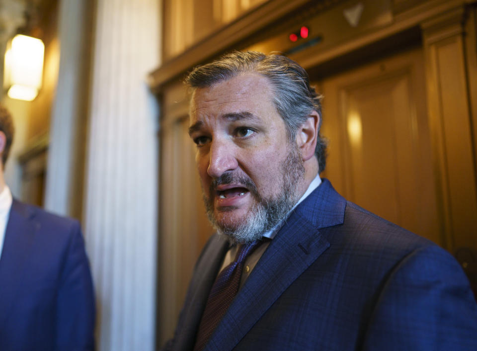 FILE - In this Aug. 5, 2021, file photo, Sen. Ted Cruz, R-Texas, leaves after a Republican luncheon, at the Capitol in Washington. As the U.S. rushes to evacuate Americans and allies from Afghanistan, a growing number of Republicans are questioning why the U.S. should take in Afghan citizens who worked side by side with Americans. (AP Photo/J. Scott Applewhite, File)