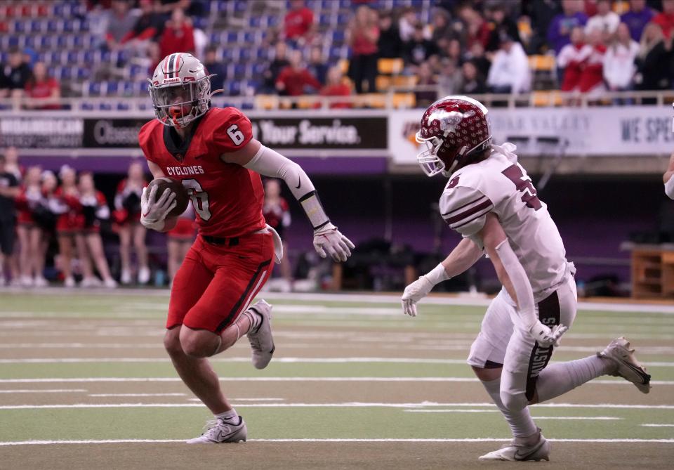 Harlan wide receiver Aidan Hall runs the ball for a touchdown against Mount Vernon during the Iowa Class 3A state football championship game