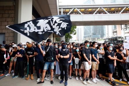 Supporters of jailed activist Leung, gather outside the High Court as Leung appeals against a conviction and sentence, in Hong Kong