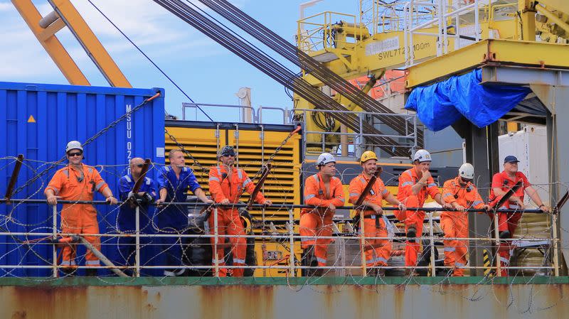 Staff of a vessel in charge of unloading oil from the decaying vessel FSO Safer are pictured off the coast of Ras Issa, Yemen, prior to the start of an operation led by the United Nations to avoid an oil spill in the Red Sea