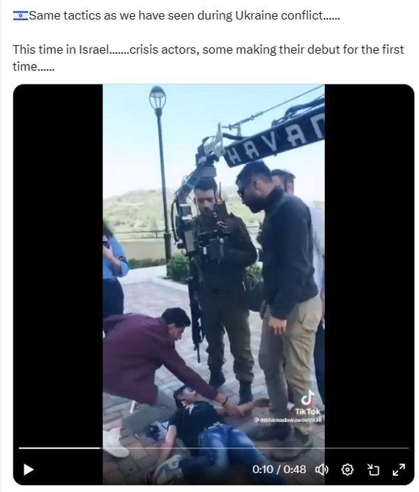 An X post says, "Same tactics as we have seen during Ukraine conflict....... This time in Israel.......crisis actors, some making their debut for the first time......" Be low is a video that shows a Palestinian boy lies on the ground. People stand around him . You can see a film camera above him.