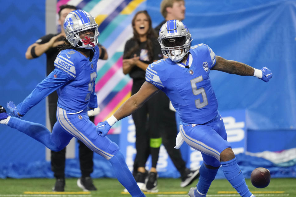 Detroit Lions running back David Montgomery (5) celebrates his touchdown carry in the first half of an NFL football game against the Carolina Panthers in Detroit, Sunday, Oct. 8, 2023. (AP Photo/Carlos Osorio)