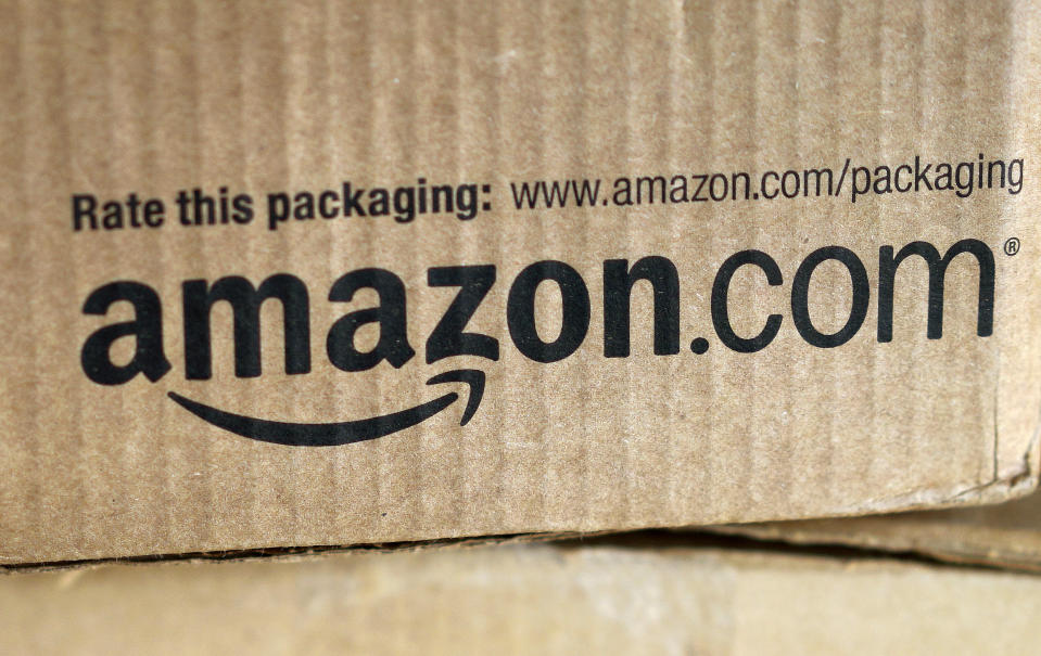 A just-delivered Amazon box is seen on a counter in Golden, Colorado August 27, 2014. With people increasingly accessing the Internet from smartphones and tablets, online companies ranging from social networks such as Facebook Inc to e-commerce companies like Amazon.com Inc have been investing heavily to develop their mobile platforms.  REUTERS/Rick Wilking (UNITED STATES - Tags: BUSINESS SCIENCE TECHNOLOGY TELECOMS)