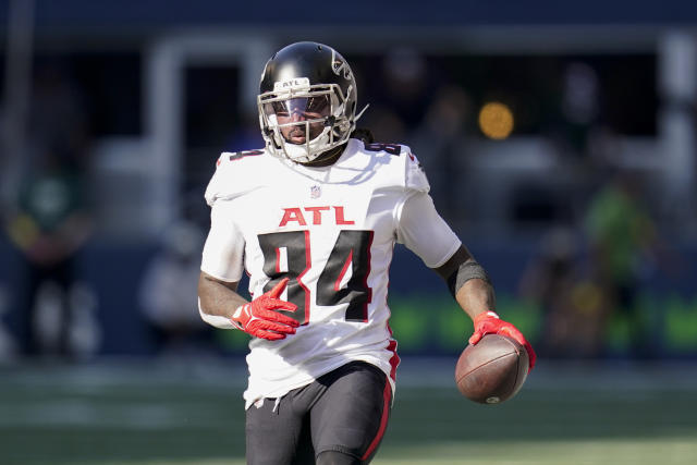 Seattle Seahawks wide receiver DK Metcalf is tackled in the endzone by  Atlanta Falcons safety Jaylinn Hawkins after catching a pass for a  touchdown in an NFL football game, Sunday, Sept. 25