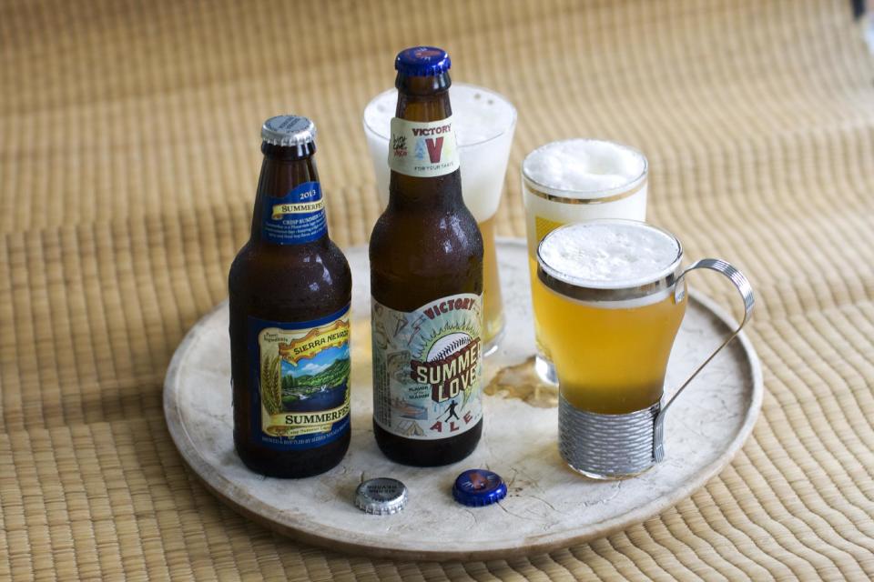 In this image taken on June 3, 2013, Summerfest, left, and Summer Love Ale are shown in Concord, N.H. (AP Photo/Matthew Mead)