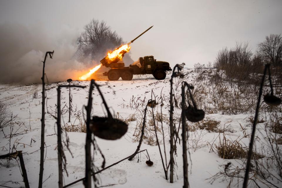 Ukrainian military fires from a multiple rocket launcher at Russian positions in the Kharkiv area, Ukraine, Saturday, Feb. 25, 2023. The Biden administration declared its Ukraine solidarity with fresh action as well as strong words on Friday, piling sweeping new sanctions on Moscow and approving a new $2 billion weapons package to re-arm Kyiv a year after Russia's invasion.