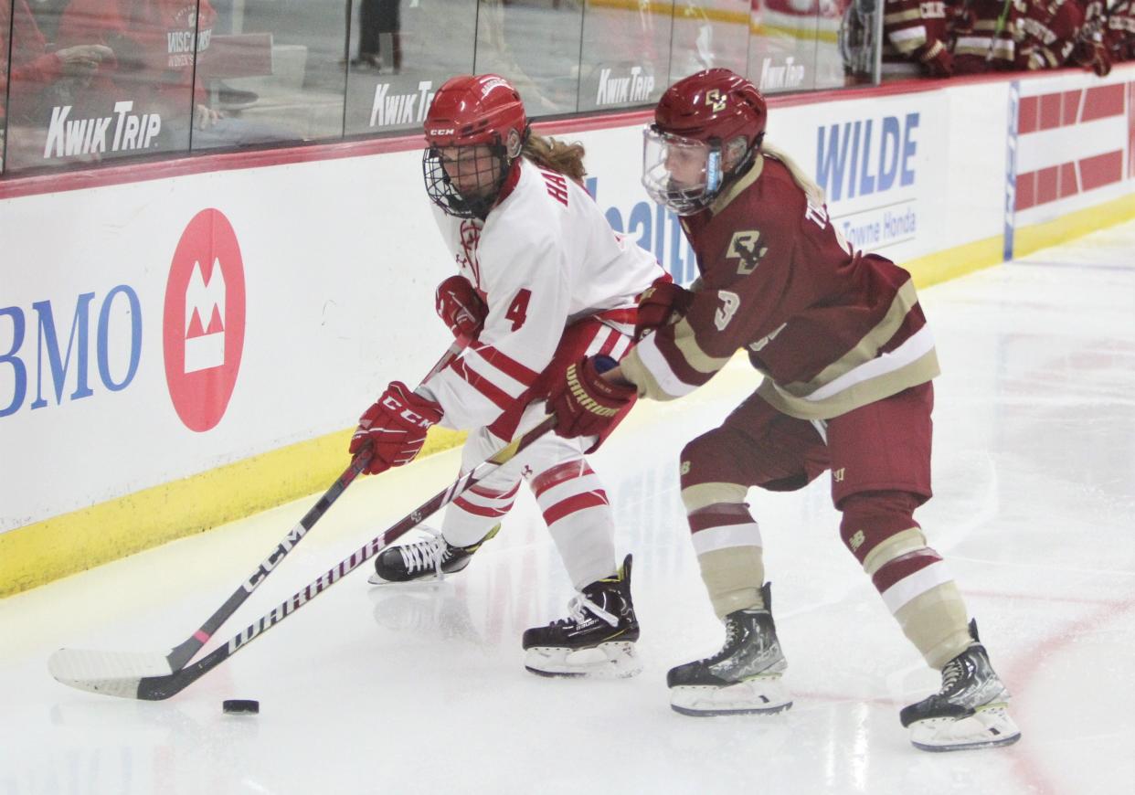 Wisconsin's Caroline Harvey fights for the puck with Boston College's Morgan Trimper on Friday Oct. 6, 2023 at LaBahn Arena in Madison, Wis.