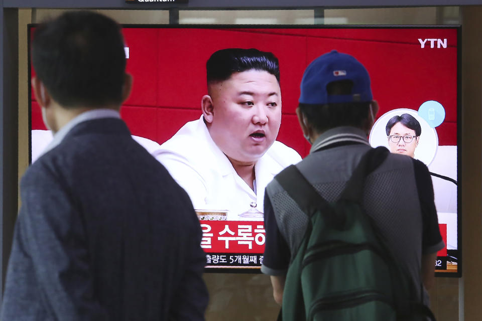 People watch a screen showing a file image of North Korean leader Kim Jong Un during a news program at the Seoul Railway Station in Seoul, South Korea, Friday, Sept. 25, 2020. Kim apologized Friday over the killing of a South Korea official near the rivals' disputed sea boundary, saying he's "very sorry" about the "unexpected" and "unfortunate" incident, South Korean officials said Friday. (AP Photo/Ahn Young-joon)