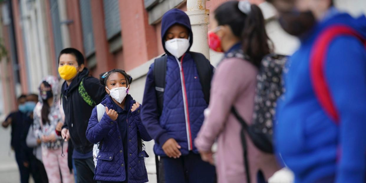 In this Sept. 29, 2020, file photo, students arrive for in person classes outside Public School 188 in New York.