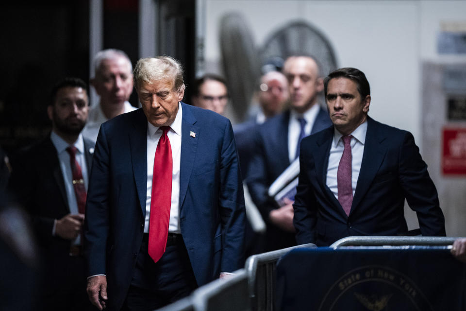 Former President Donald Trump arrives at Manhattan criminal court with his legal team ahead of the start of jury selection in New York, Monday, April 15, 2024. (Jabin Botsford/Pool Photo via AP)