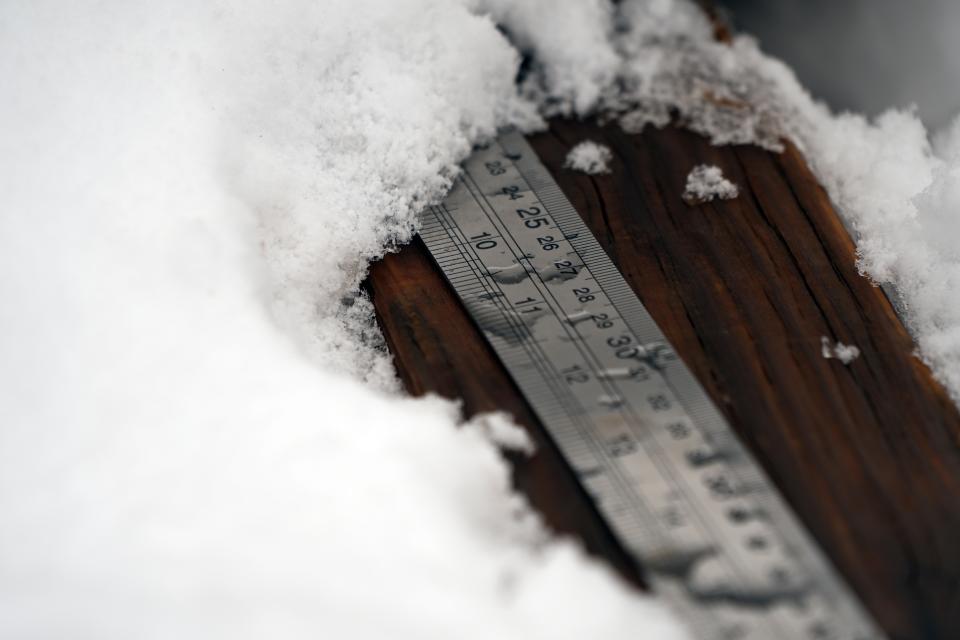 A ruler Billy Barr uses to measure snow depth is stored Wednesday, March 13, 2024, in Gothic, Colo. So-called “citizen scientists” like Barr have long played important roles in gathering data to help researchers better understand the environment. His once hand-recorded measurements have informed numerous scientific papers and helped calibrate aerial snow sensing tools. (AP Photo/Brittany Peterson)