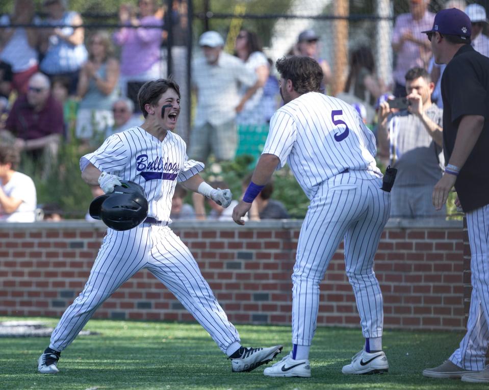 Parker Shenman celebrates after scoring Rumson-Fair Haven's first run in the Bulldogs' 8-3 win over Spotswood Friday in the NJSIAA Central Group 2 championship game.