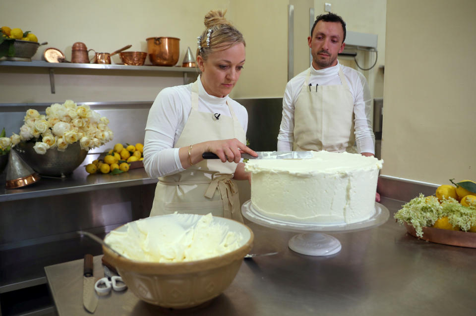 Claire Ptak and <span>head baker Izaak Adams </span>work on Harry and Meghan’s royal wedding cake. [Photo: PA]