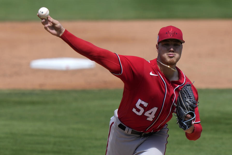 Washington Nationals starting pitcher Cade Cavalli (54) throws during the third inning of a spring training baseball game against the New York Mets, Tuesday, March 14, 2023, in Port St. Lucie, Fla. (AP Photo/Lynne Sladky)