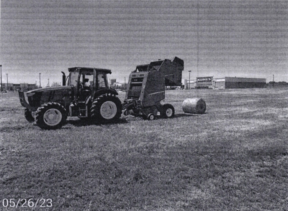 A photograph was filed with the Kansas Board of Tax Appeals as an exhibit to demonstrate agricultural activity taking place on May 26, 2023, in the Plaza at the Speedway outdoor shopping mall in Kansas City, Kansas. Under state law, developers receive major property tax breaks by labeling vacant commercial land as devoted to agricultural use. Wyandotte County is fighting the designation in court.