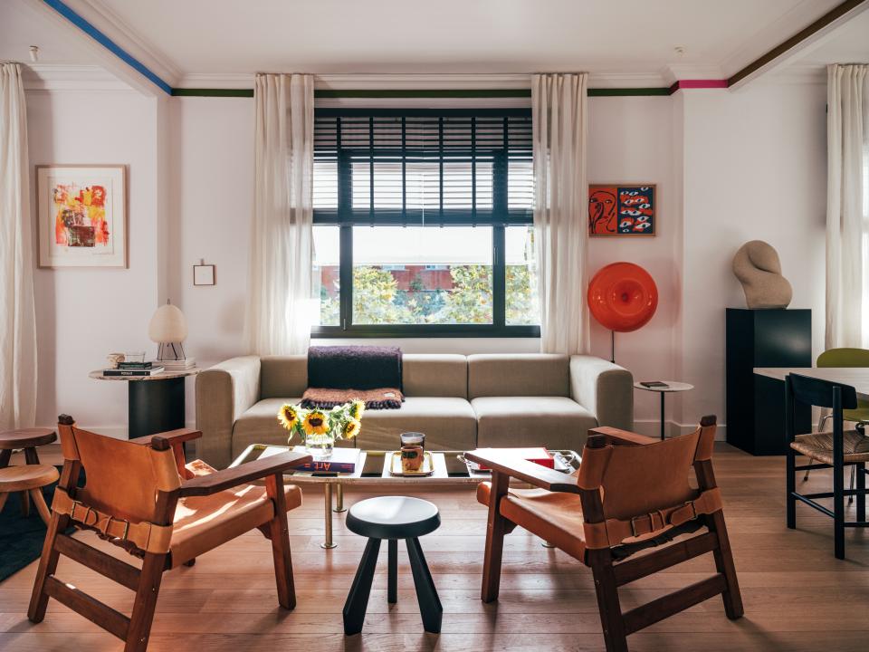 Wood and leather chairs by Heaps & Woods create an immediate warmth in the living room. Robert Rauschenberg’s Storyline II lithograph, one of Juan’s most prized prints, brings the room together with vibrant hues and a buoyant mood.