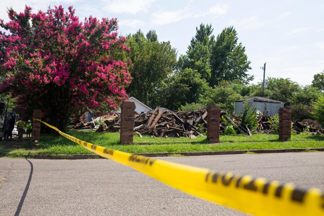 Crime scene tape can be seen in front of the home at 2047 Rile St. that burned down just after 11:30 p.m. Tuesday evening in South Memphis, on Wednesday, July 19, 2023. Four firefighters were injured in the fire with one, Lieutenant Jeffrey Norman, later dying from his injuries.