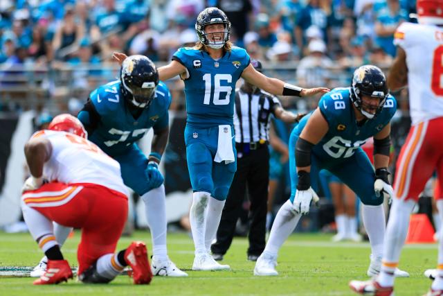 Jacksonville Jaguars quarterback Trevor Lawrence (16) looks for a