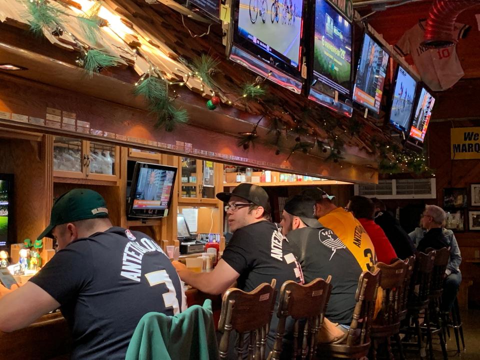 Bucks fans line the bar at Major Goolsby's before a game.