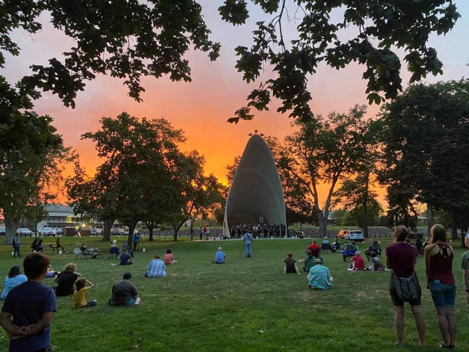 People gathered at Howard Amon Park in 2022 for a Lights for Peace event to remember the 1945 atomic bombing on Aug. 9, 1945.