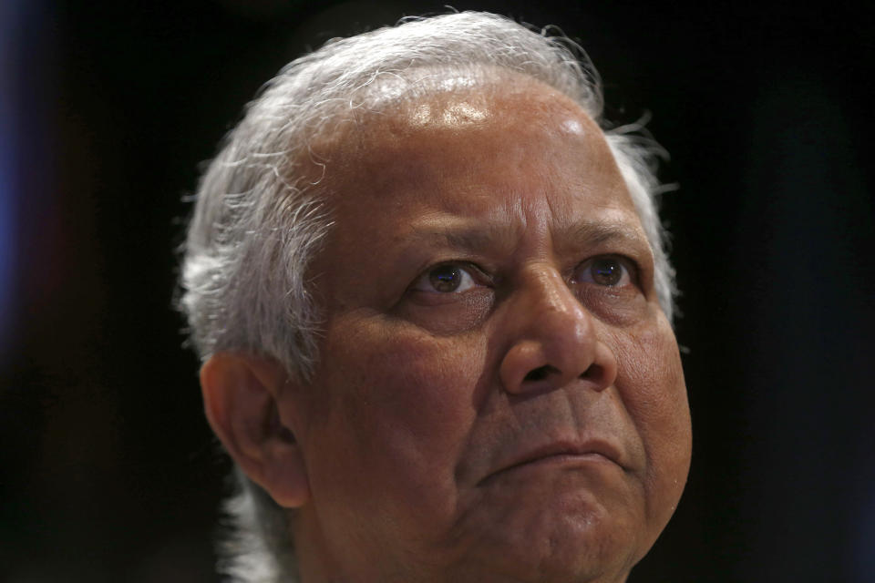 FILE- Nobel Peace Prize winner Muhammad Yunus listens to a discussion on poverty at the World Bank Group International Monetary Fund Spring Meetings in Washington, April 19, 2013. A labor court in Bangladesh’s capital Monday sentenced Yunus to six months in jail for violating the country’s labor laws. (AP Photo/Charles Dharapak, File)