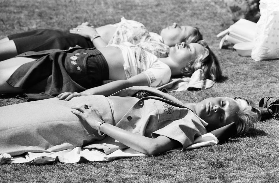 Three girls sunbathing in Birmingham during the summer heatwave of 1976. 28th June 1976. (Photo by Birmingham Post and Mail Archive/Mirrorpix/Mirrorpix via Getty Images)