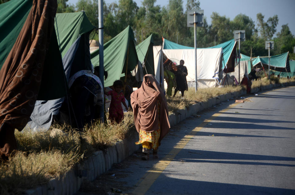 FILE: Displaced people start to live at makeshift camps after the flood hit their homes due to heavy monsoon rains in Nowshera district of Khyber Pakhtunkhwa on August 30, 2022.  / Credit: Hussain Ali/Anadolu Agency via Getty Images