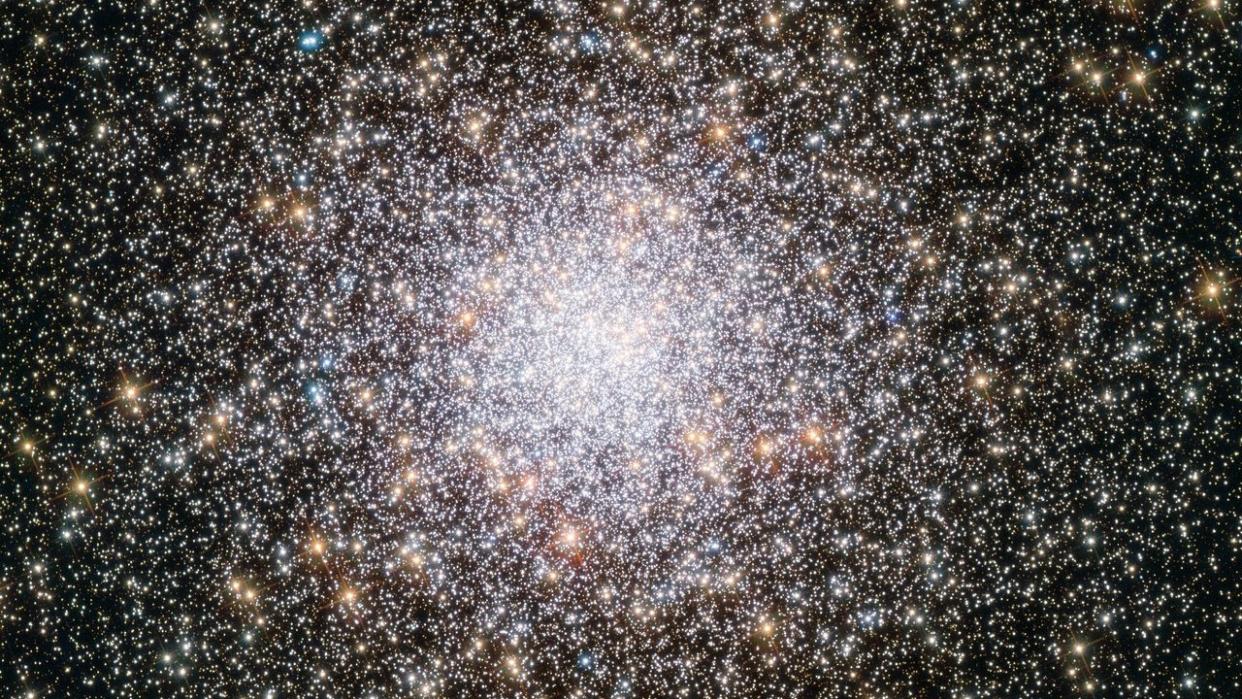  A bright collective of millions of stars, scattered around the edges bu combining to look like one big star at the center 