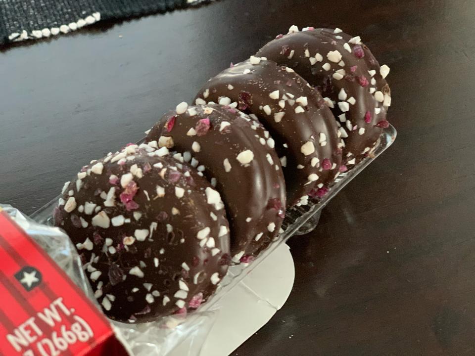 tray pulled from box of trader joes chocolate covered peppermint joe joes on dark wood table