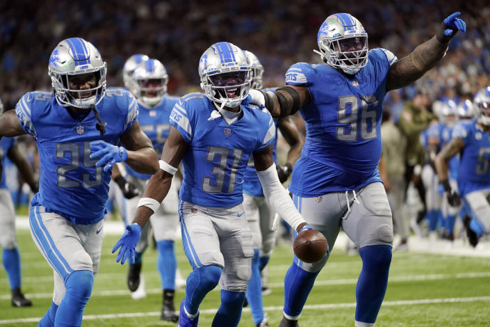 Detroit Lions safety Kerby Joseph (31) and teammates react after a play during the second half of an NFL football game against the Green Bay Packers, Sunday, Nov. 6, 2022, in Detroit. (AP Photo/Paul Sancya)
