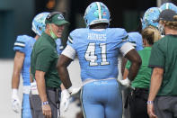 Tulane head coach Willie Fritz, left, shouts to players during a timeout in the first half of an NCAA college football game against Central Florida, Saturday, Oct. 24, 2020, in Orlando, Fla. (AP Photo/John Raoux)