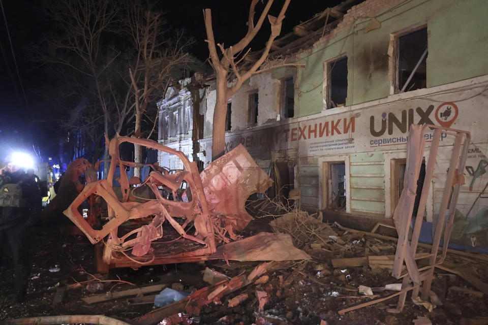 In this photo provided by Kharkiv Regional Administration, an apartment house damaged in Russian rocket attack is seen in Kharkiv, Ukraine, in the early hours of Wednesday, Jan. 17, 2024. (Kharkiv Regional Administration via AP)
