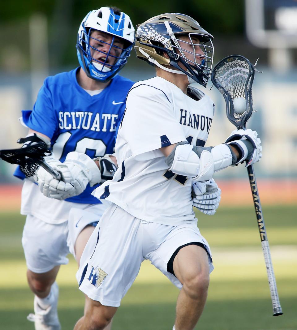 Hanover’s Max Dasilva brings the ball upfield late in the fourth quarter of their game against Scituate at Hanover High on Thursday, May 20, 2021.