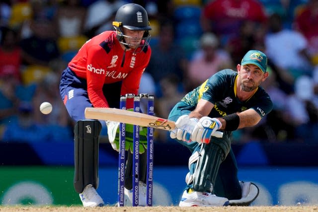 Glenn Maxwell reverse sweeps as Jos Buttler looks on