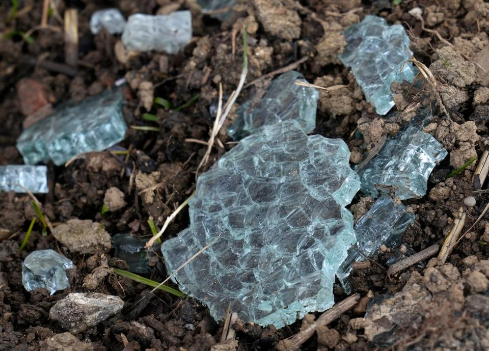 Jan. 10, 2023; Columbus, OH, U.S.; Broken glass is seen on the ground at the Wedgewood Village Apartments. The source of the glass was undeterminable. Mandatory Credit: Barbara J. Perenic/Columbus Dispatch