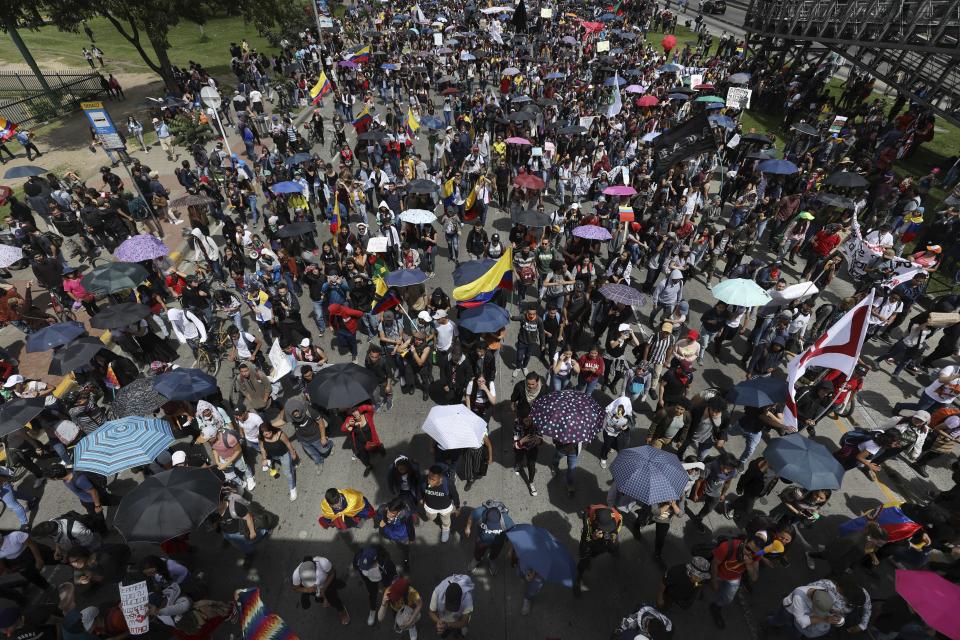 Demonstrators march during a national strike in Bogota, Colombia, Wednesday, Dec. 4, 2019. Colombia’s recent wave of demonstrations began with a massive strike on Nov. 21 that drew an estimated 250,000 people to the streets. Protests have continued in the days since but at a much smaller scale. (AP Photo/Fernando Vergara)