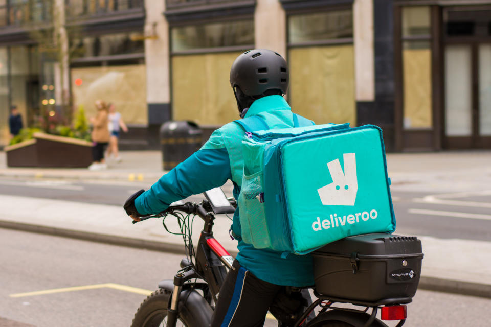 REGENT STREET, LONDON, UNITED KINGDOM - 2021/03/31: Deliveroo courier rides along Regent Street delivering Takeaway food  in central London. (Photo by Pietro Recchia/SOPA Images/LightRocket via Getty Images)